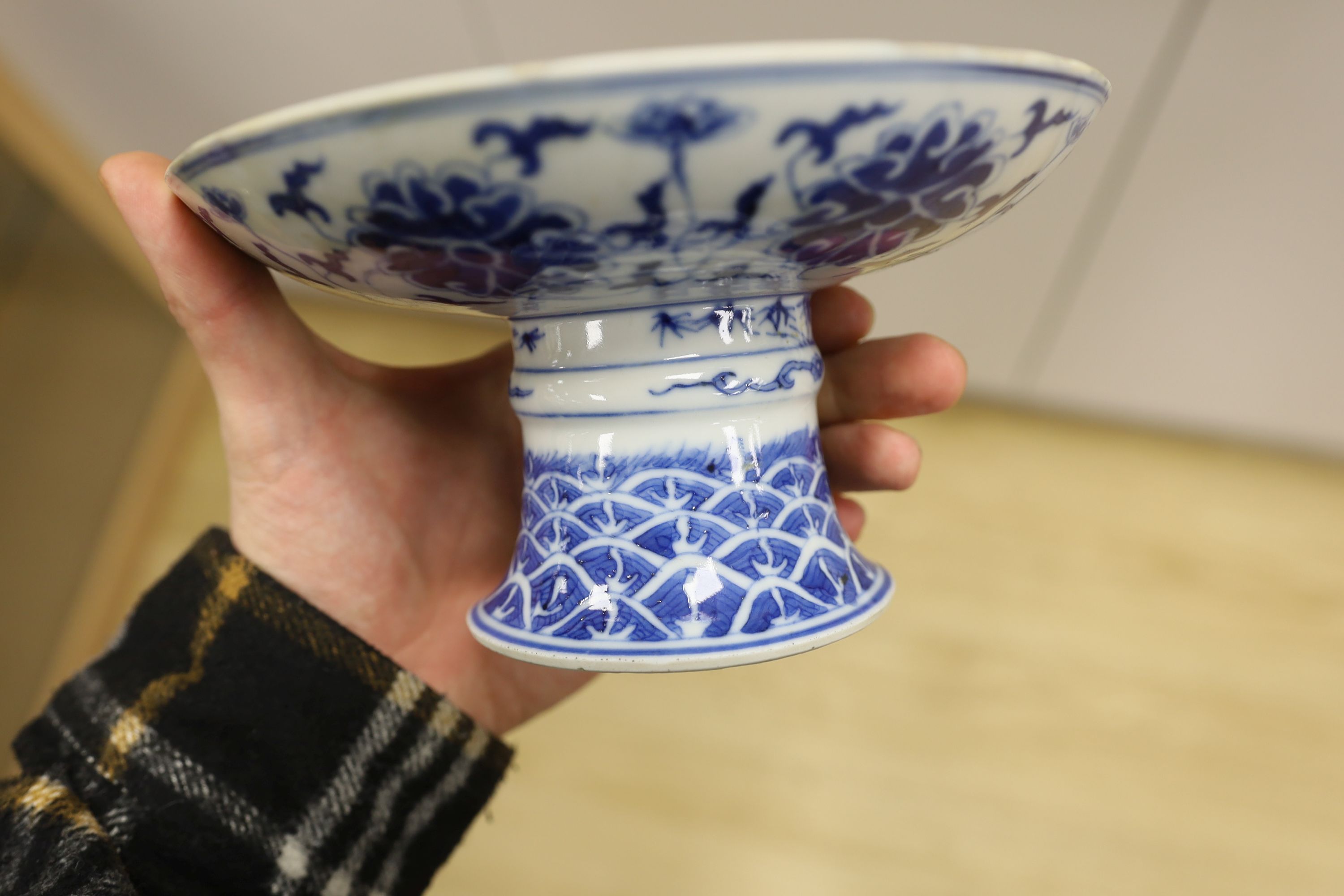 A Chinese underglaze copper red ‘herder and goats’ vase, Kangxi six character mark but Republic period and a Chinese blue and white lotus stem dish, six character Guangxu mark and period, both damaged